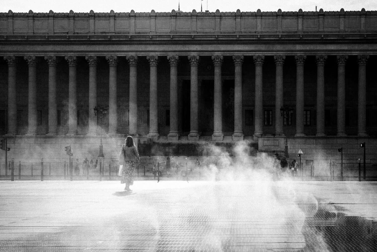Street-photography-France-23 woman walking through the fog in the city. France