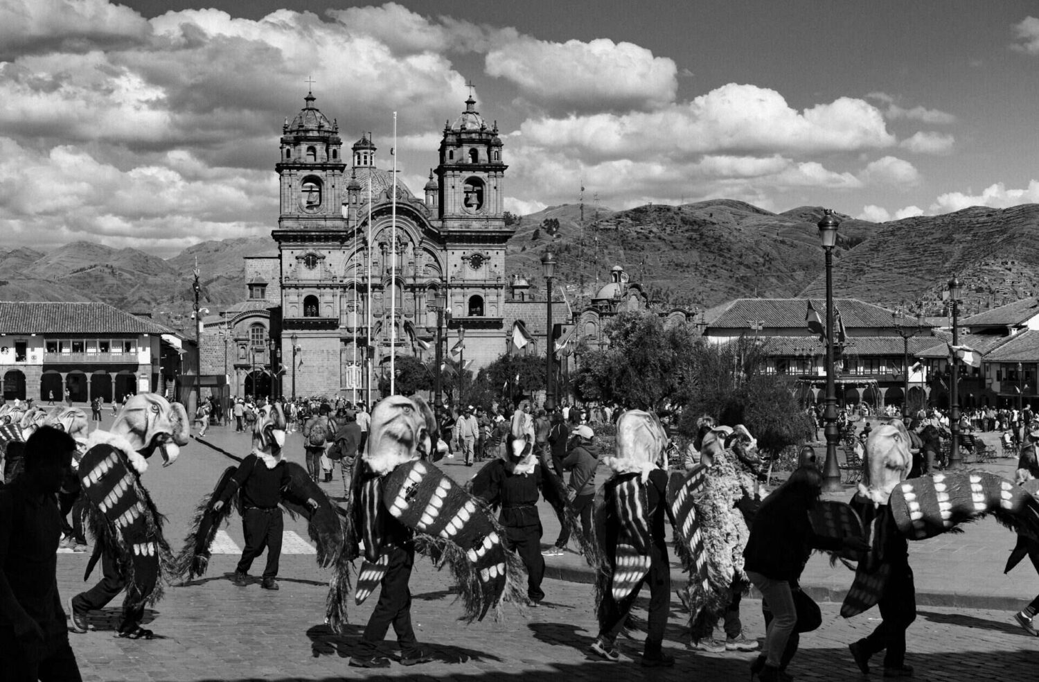  A wide, atmospheric shot of a narrow Cusco street, with cobblestones, Inca stone foundations, and colonial balconies. cusco street photography