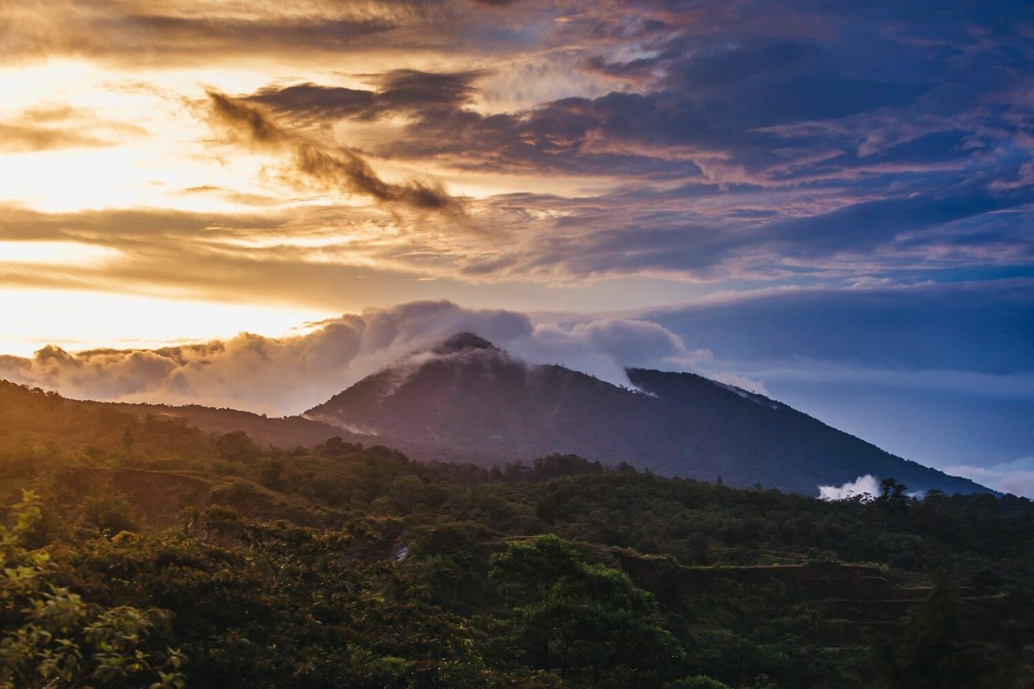 photography of a mountain in costa rica during winter sunset