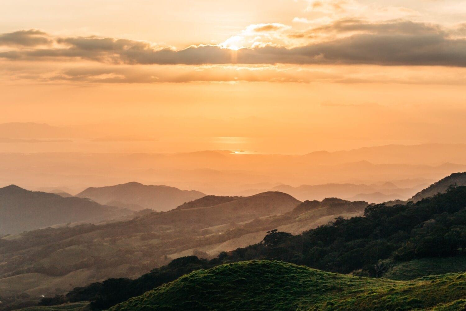 outdoor photography of a sunset in the pacific coast of costa rica